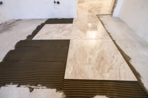 Ceramic tiles. Floor tiles installation. Home improvement, renovation - ceramic tile floor